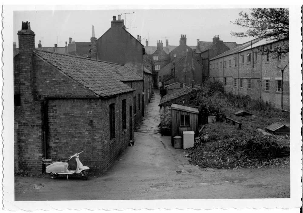 Another yard off Applegarth, located on the far side of Barkers to Market Row; it was used as a carpet workshop and storage facility for beds, 1971